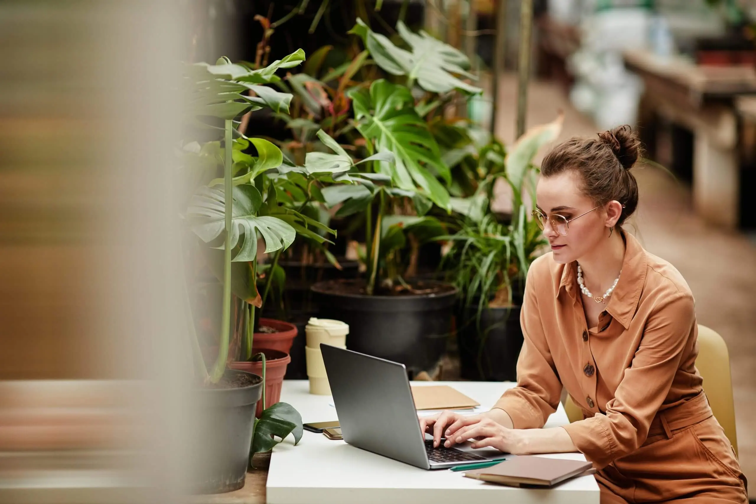 Woman writing in an article on Crownsville Media on writing SEO-focused listicles.