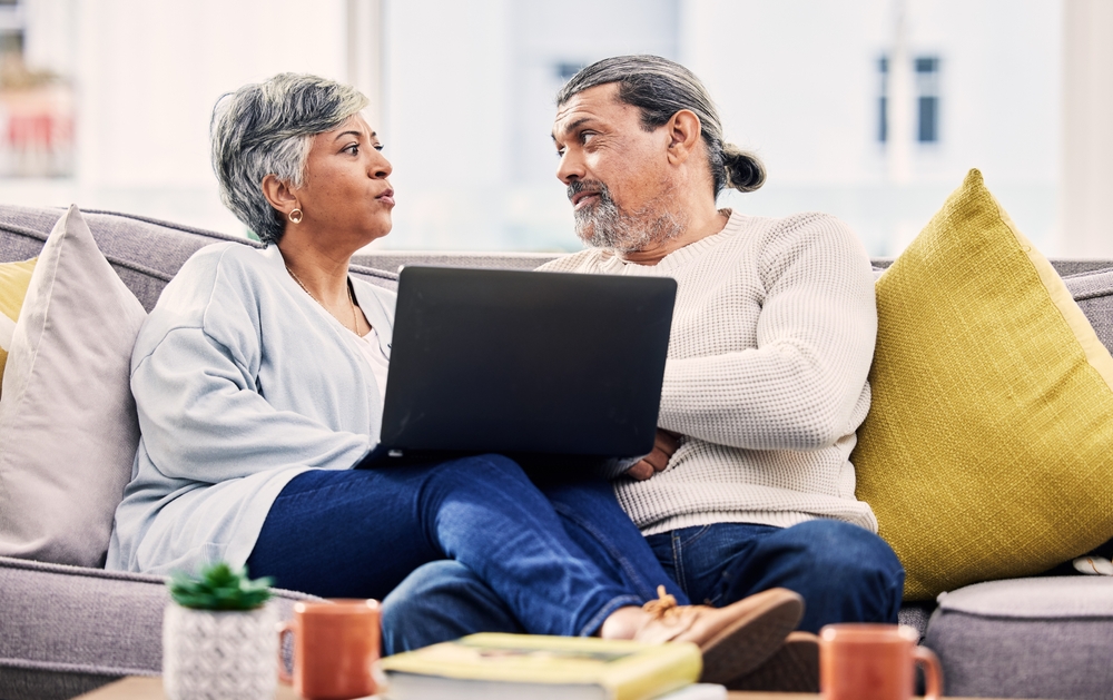 Couple talking in an article by crownsville media on when its time to redesign your website