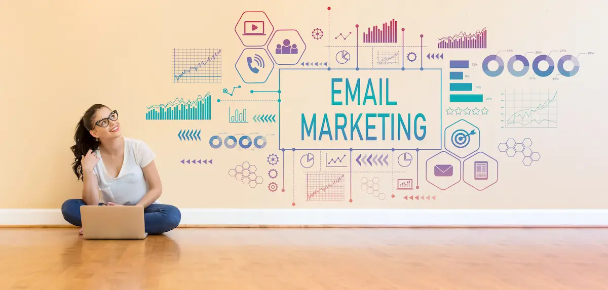 What is email marketing concept with laptop user and analytics graphics showing email campaigns charts and digital strategy