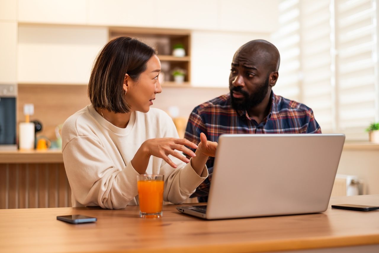 Two people work at their laptop trying to figure out their local seo