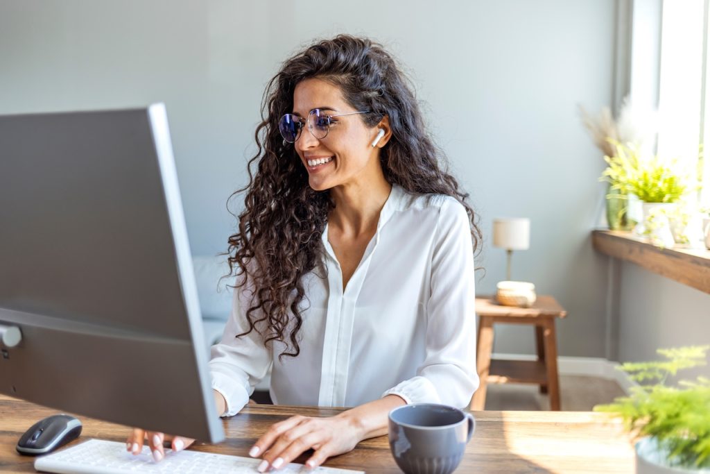 | crownsville media - seo, ai visibility & digital marketing for small business owners | crownsville media - seo, ai visibility & digital marketing for small business owners Smiling woman with curly hair and glasses sits with therapy client online