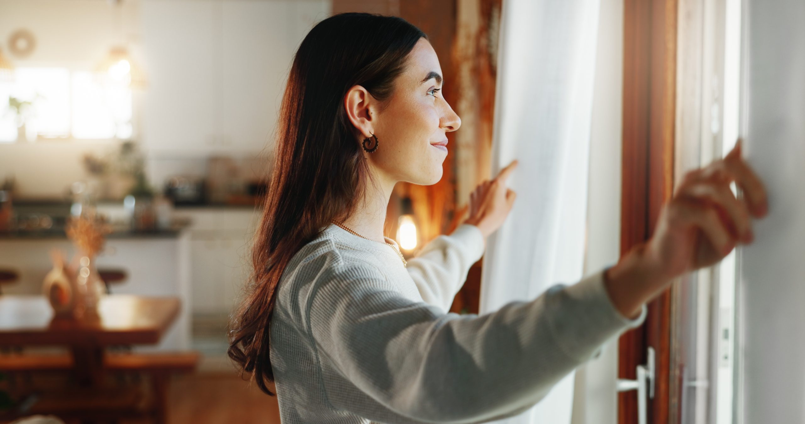 Woman looking out the window in an article by melanie gorman on common sense seo